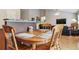 Open kitchen with wood cabinets and adjoining breakfast nook at 2958 S Lisbon Way, Aurora, CO 80013