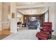 Spacious living room with an open floor plan, neutral colors, comfortable seating, and a seamless flow between rooms at 2958 S Lisbon Way, Aurora, CO 80013