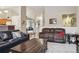Spacious living room showcasing an open floor plan, plush seating, and neutral tones, creating a cozy atmosphere at 2958 S Lisbon Way, Aurora, CO 80013