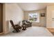 Bright and airy living room with comfortable seating, a large window offering pleasant views, and a relaxed atmosphere at 2958 S Lisbon Way, Aurora, CO 80013