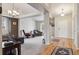 Bright living room with a vaulted ceiling, comfortable seating, and large windows, showcasing an open and airy space at 2958 S Lisbon Way, Aurora, CO 80013