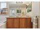 Double vanity in the main bathroom with a large mirror and coordinated towels at 2958 S Lisbon Way, Aurora, CO 80013