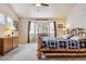 Cozy main bedroom with a natural log frame bed and a bright window at 2958 S Lisbon Way, Aurora, CO 80013