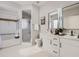 Bright bathroom featuring double sinks with modern fixtures and a tub/shower combination at 6444 Silver Mesa Dr # A, Highlands Ranch, CO 80130