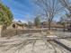 Gated community pool area with mature landscaping, trees, and nearby clubhouse for relaxation and recreation at 6444 Silver Mesa Dr # A, Highlands Ranch, CO 80130