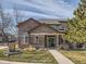 Charming two-story home featuring brick and neutral siding, complemented by a well-maintained lawn and inviting entrance at 6444 Silver Mesa Dr # A, Highlands Ranch, CO 80130