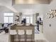 Modern kitchen with sleek white cabinetry, stainless steel appliances, and a convenient breakfast bar for casual dining and entertaining at 6444 Silver Mesa Dr # A, Highlands Ranch, CO 80130