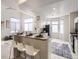 Modern kitchen with sleek white cabinetry, stainless steel appliances, and a convenient breakfast bar for casual dining and entertaining at 6444 Silver Mesa Dr # A, Highlands Ranch, CO 80130