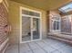 Back patio featuring sliding glass door, brick pillar, and privacy at 6444 Silver Mesa Dr # A, Highlands Ranch, CO 80130