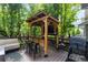 Enjoy outdoor living with this back deck featuring a barbecue, outdoor seating, and a serving bar at 5301 Clovervale Cir, Highlands Ranch, CO 80130