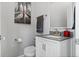 Elegant bathroom features a white vanity, silver faucet, and a decorative piece of artwork at 5301 Clovervale Cir, Highlands Ranch, CO 80130