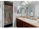 A vanity with double sinks is featured in this well lit bathroom at 5301 Clovervale Cir, Highlands Ranch, CO 80130
