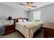 Cozy bedroom featuring carpet floors, a ceiling fan, and a comfortable bed at 5301 Clovervale Cir, Highlands Ranch, CO 80130