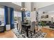 Inviting dining area with stylish chandelier, fireplace, and views to the living room at 5301 Clovervale Cir, Highlands Ranch, CO 80130