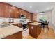 Well-equipped kitchen features stainless steel appliances, granite countertops, and wood cabinets at 5301 Clovervale Cir, Highlands Ranch, CO 80130