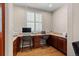 Convenient home workstation is located off the kitchen and features wood floors and a sunny window at 5301 Clovervale Cir, Highlands Ranch, CO 80130