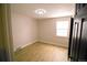 Bright bedroom featuring hardwood floors, neutral walls, and a window for natural light at 3040 S Clermont Dr, Denver, CO 80222