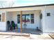 Charming covered front porch enhanced with seating, decorative plants, and tasteful decor that adds warmth and curb appeal at 3040 S Clermont Dr, Denver, CO 80222