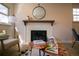 Cozy living room featuring a white brick fireplace, with stylish decor and modern furnishings at 3040 S Clermont Dr, Denver, CO 80222