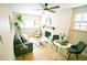 Bright living room featuring modern decor, a fireplace, and a comfortable seating area at 3040 S Clermont Dr, Denver, CO 80222