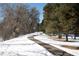 Scenic path lined with trees and snow, offering a peaceful outdoor experience at 3040 S Clermont Dr, Denver, CO 80222