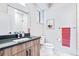 Well-lit bathroom with updated vanity, modern fixtures, and a shower with tile surround at 9052 Harlan St, Westminster, CO 80031