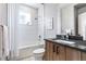 Bright bathroom features a tiled shower and modern vanity at 9052 Harlan St, Westminster, CO 80031