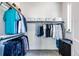 Walk-in closet providing ample storage, shelving, and rods for hanging clothes with lots of shelving at 9052 Harlan St, Westminster, CO 80031