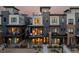 Modern townhome exterior with multiple balconies, showcasing contemporary design and curb appeal at 9052 Harlan St, Westminster, CO 80031