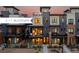 Modern townhome showcasing brick and siding, complete with balconies for outdoor enjoyment and sunset views at 9052 Harlan St, Westminster, CO 80031