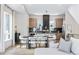 Open-concept kitchen with modern appliances, center island, and adjacent dining area for seamless entertaining at 9052 Harlan St, Westminster, CO 80031