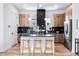 Stylish kitchen with stainless steel appliances, custom cabinets, and a functional center island at 9052 Harlan St, Westminster, CO 80031