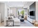 Bright living room features a sliding glass door to outdoor space and stylish decor at 9052 Harlan St, Westminster, CO 80031