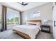 Serene main bedroom features large windows and neutral decor at 9052 Harlan St, Westminster, CO 80031