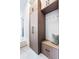 Well-organized mudroom with custom cabinetry, seating, and storage space for an efficient entryway at 9052 Harlan St, Westminster, CO 80031