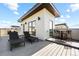 Rooftop deck with lounge chairs, bar seating, and sleek modern design at 9052 Harlan St, Westminster, CO 80031