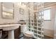 Contemporary bathroom with a glass block shower wall, sleek fixtures, and vessel sink at 8622 S Everett St, Littleton, CO 80128