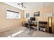 Bright bedroom with a large window, neutral walls, and modern lighting fixture above workspace at 8622 S Everett St, Littleton, CO 80128