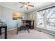 Inviting bedroom featuring a large window, neutral carpet, and serene wall color at 8622 S Everett St, Littleton, CO 80128