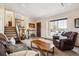 Comfortable living area showcasing a staircase, and bright window at 8622 S Everett St, Littleton, CO 80128