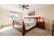 Cozy main bedroom with a ceiling fan, neutral walls, and comfortable queen-size bed at 8622 S Everett St, Littleton, CO 80128