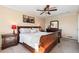 Comfortable main bedroom with a decorative ceiling fan and ample natural light at 8622 S Everett St, Littleton, CO 80128