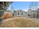 Backyard with landscaped yard and a view of the home at 1668 Holeman Dr, Erie, CO 80516