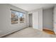 Bedroom with closet, carpet, and large window at 1668 Holeman Dr, Erie, CO 80516