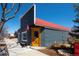 Rustic building features unique wood accents, a red roof, and charming architectural details at 1668 Holeman Dr, Erie, CO 80516