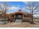 Community clubhouse entrance with landscaped walkway and inviting architecture at 1668 Holeman Dr, Erie, CO 80516