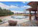 A community pool with adjacent outdoor space for relaxation and recreation at 1668 Holeman Dr, Erie, CO 80516