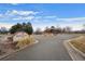 Arapahoe Ridge community entrance with well-maintained landscaping and clear signage at 1668 Holeman Dr, Erie, CO 80516