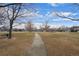 Community green space with walking path and picnic area, ideal for outdoor activities at 1668 Holeman Dr, Erie, CO 80516