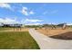 Bright playground features modern equipment, a walking path, and lush green spaces for recreational activities at 1668 Holeman Dr, Erie, CO 80516